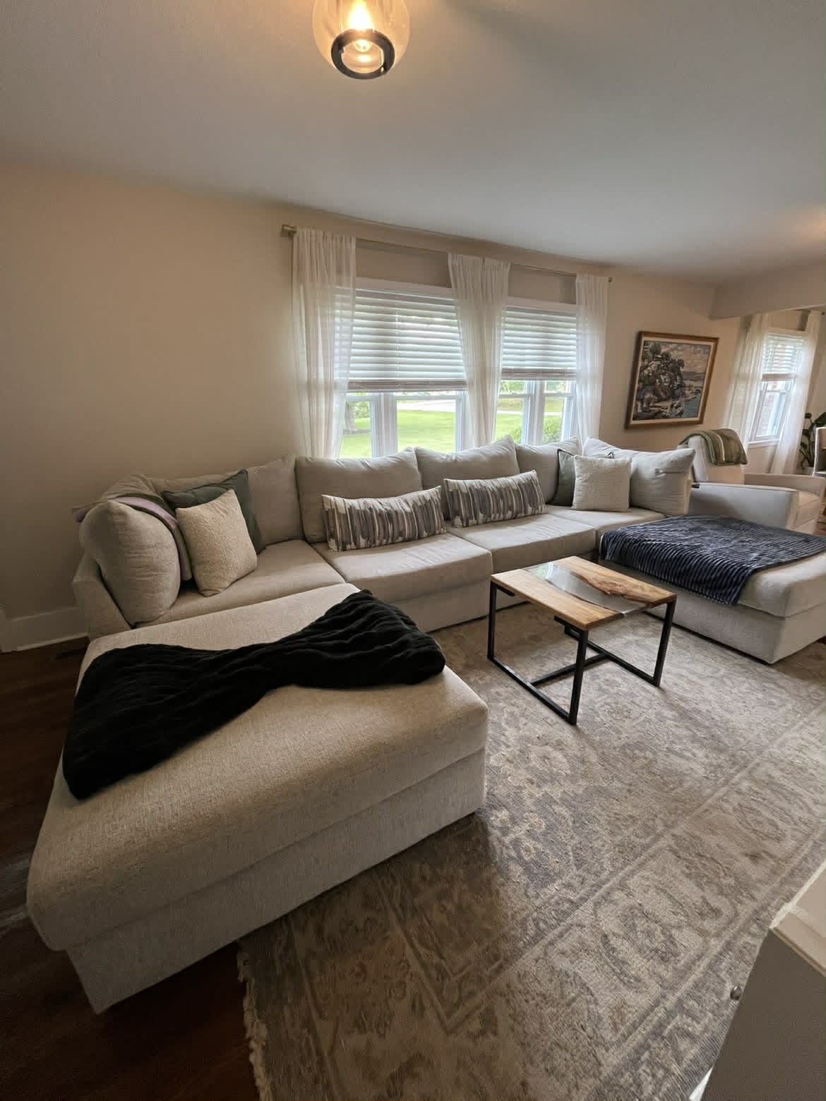 Living room with beige sectional full view