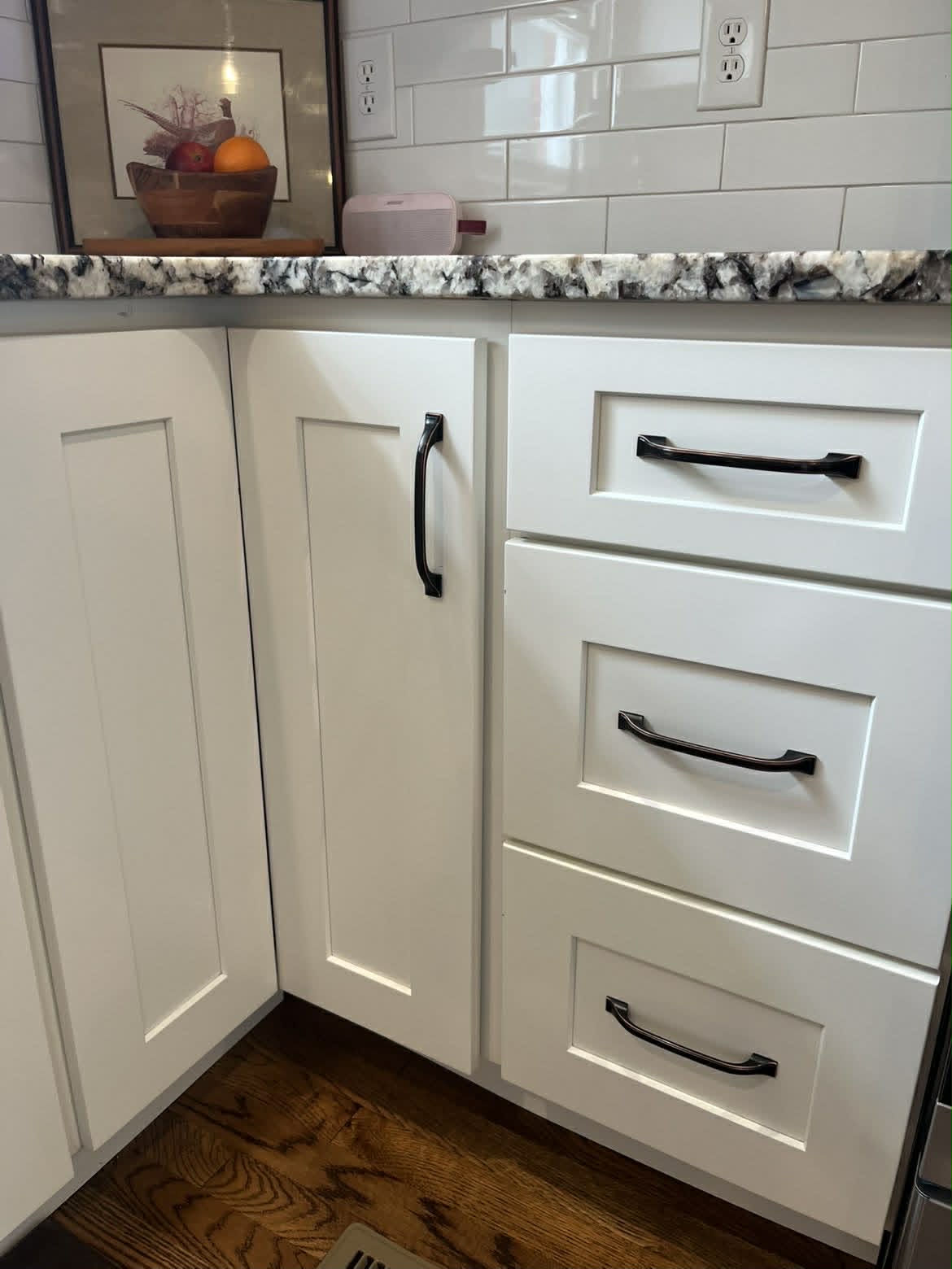 Clean white kitchen lower cabinet corner